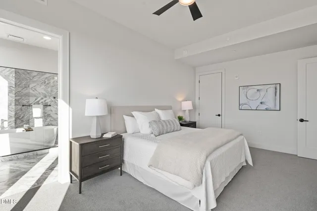 a view of a hallway with wooden floor and closet area