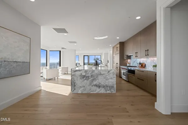 a kitchen with counter top space a sink and cabinets