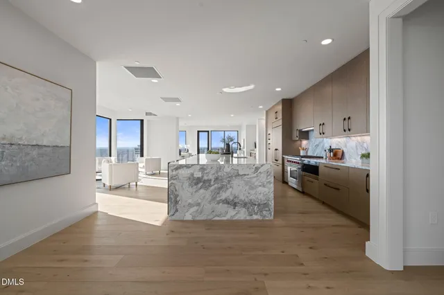 a kitchen with counter top space a sink and cabinets