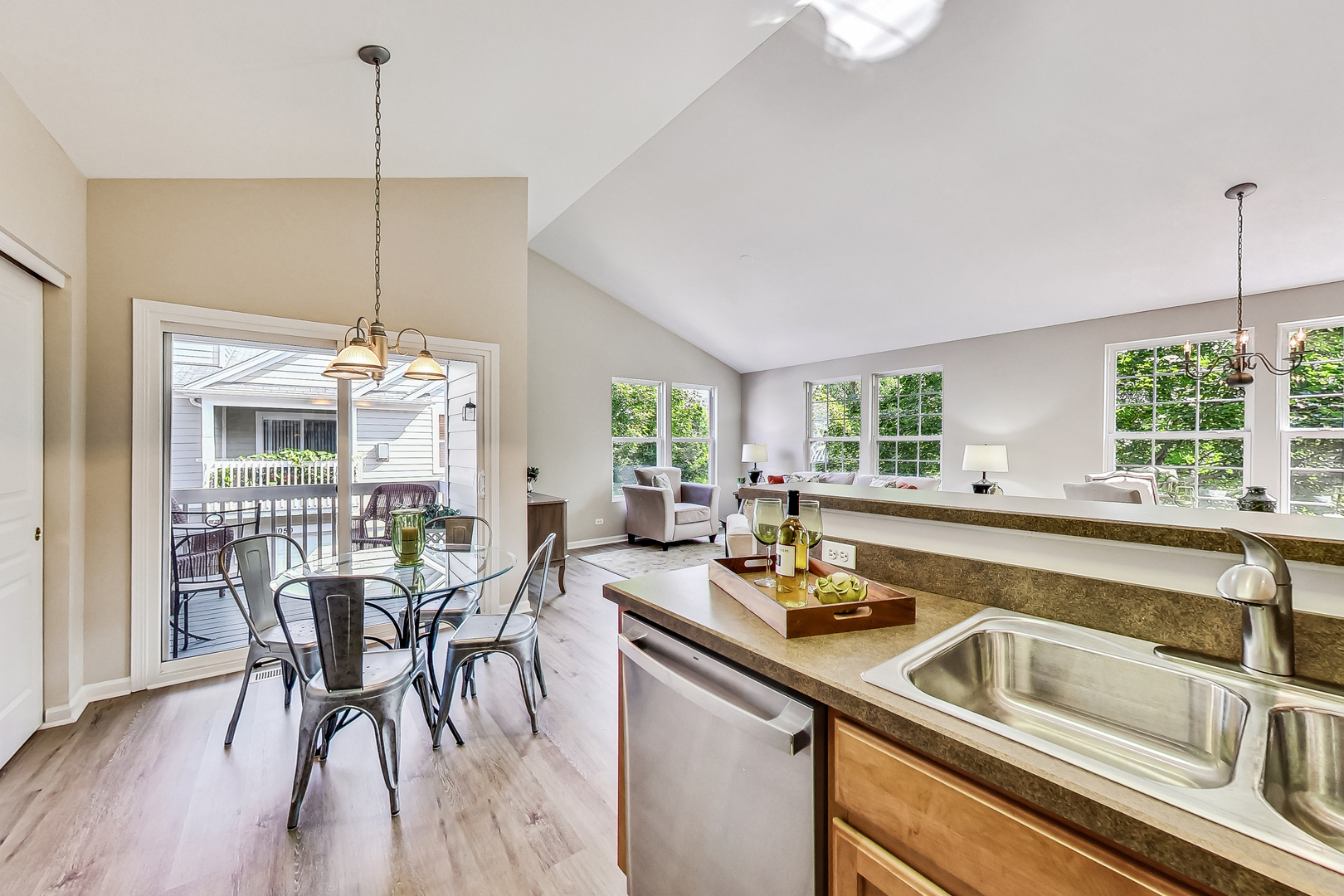 1052 Reserve Drive Elgin, IL 60123 - Photo 15 of 40 a kitchen with a table chairs stove and wooden floor