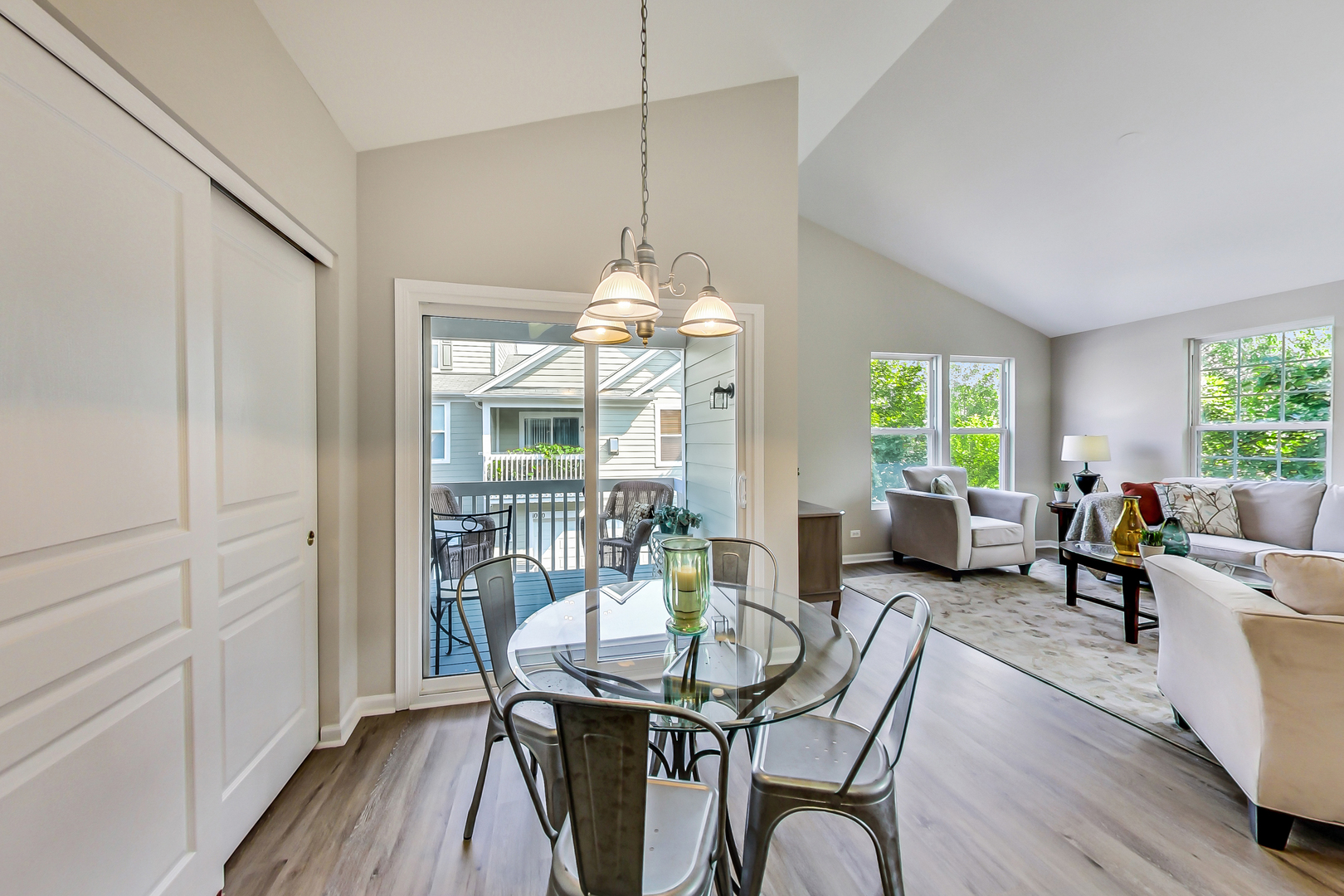 1052 Reserve Drive Elgin, IL 60123 - Photo 16 of 40 a dining room with furniture a chandelier and wooden floor