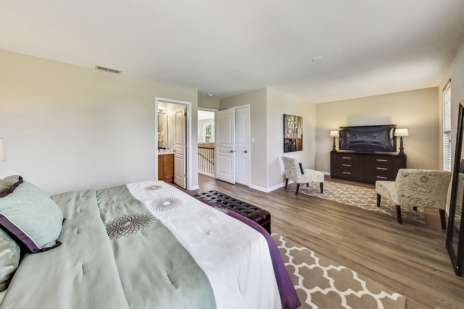 1052 Reserve Drive Elgin, IL 60123 - Photo 20 of 40 a bedroom with a bed and wooden floor