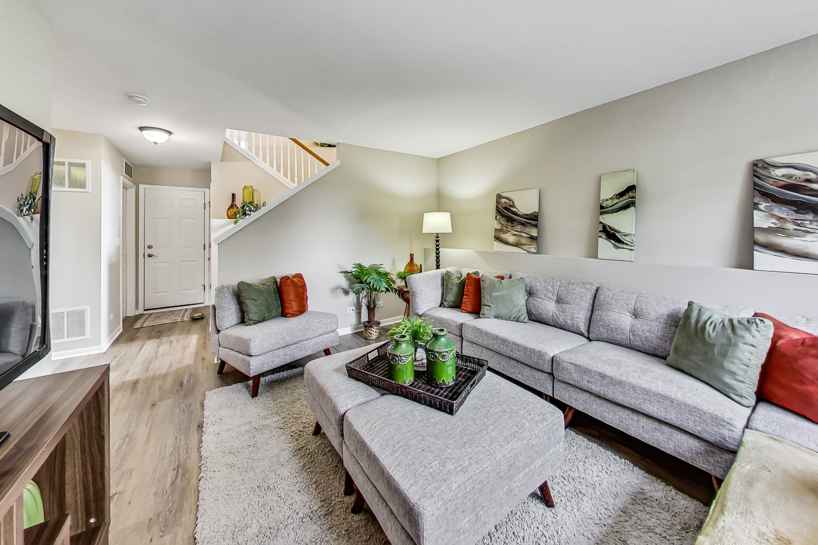 1052 Reserve Drive Elgin, IL 60123 - Photo 27 of 40 a living room with furniture and a painting