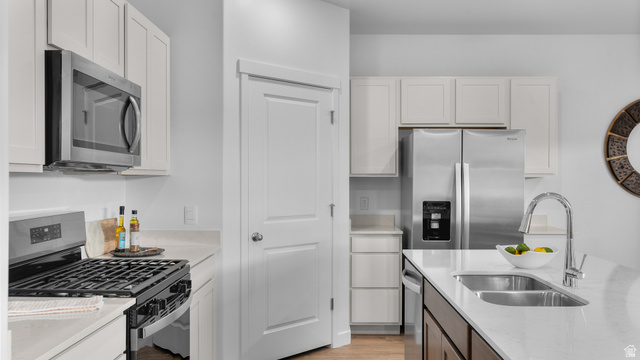 2032 East Dorset Way, Unit 286 Salem, UT 84653 - Photo 9 of 23 Modern kitchen featuring a stainless steel gas range, microwave, and refrigerator