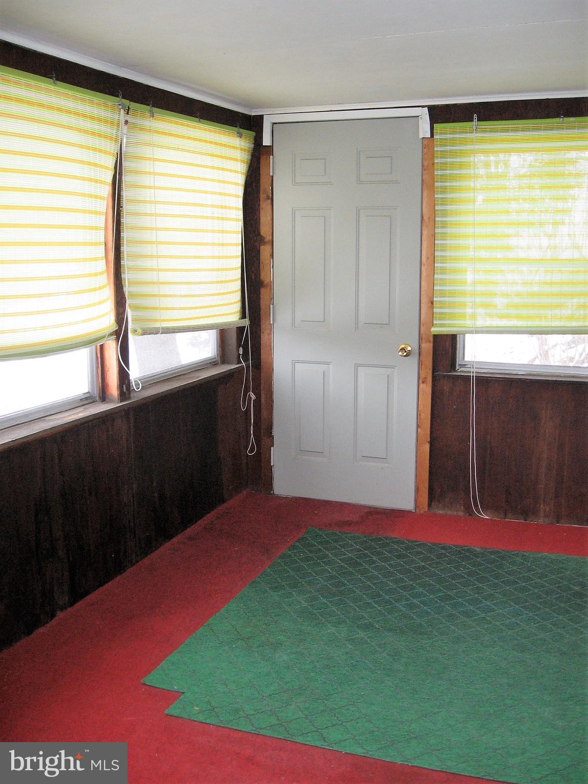 2562 Virginia Line Road Berkeley Springs, WV 25411 - Photo 34 of 45 enclosed front porch