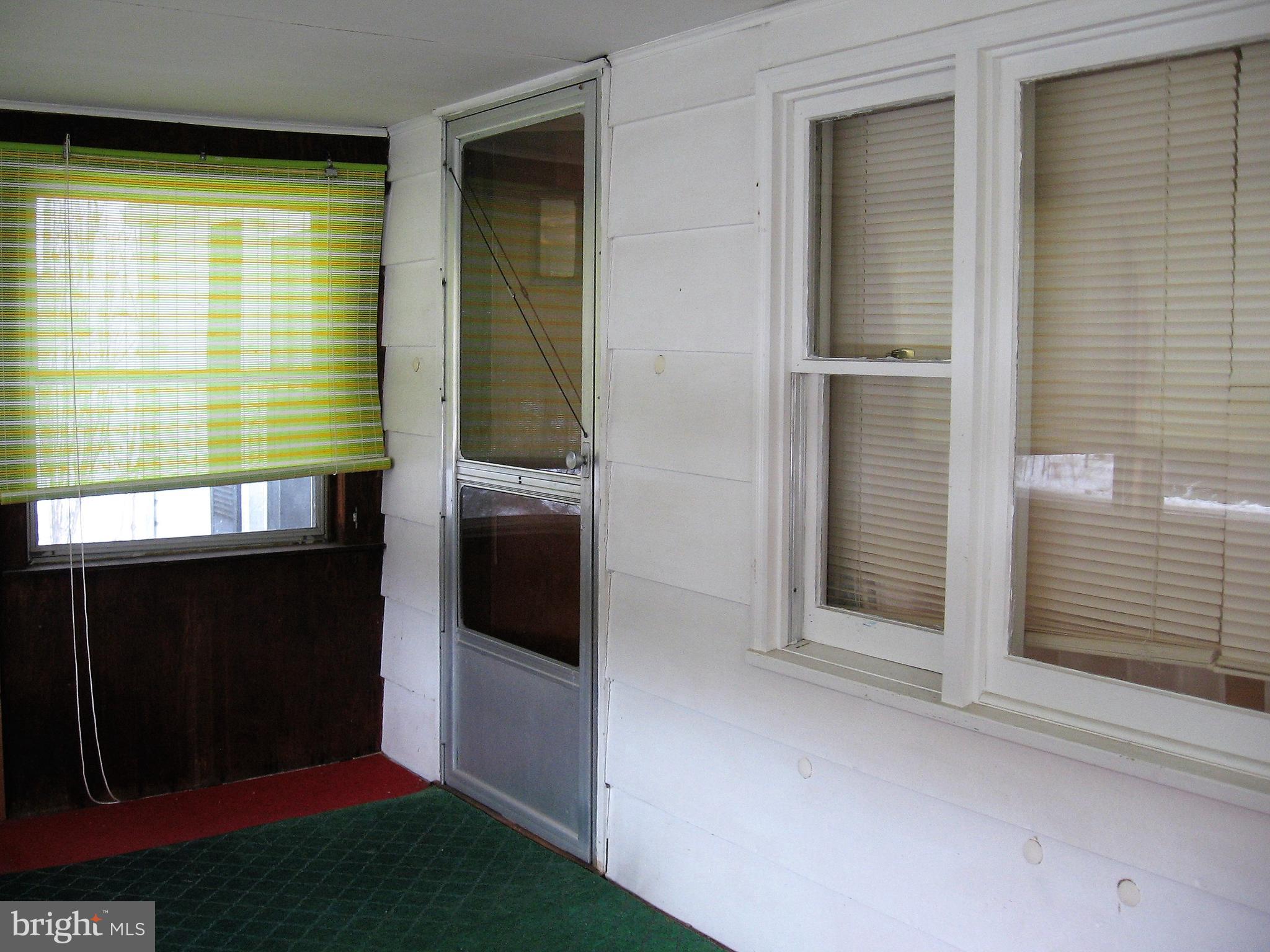2562 Virginia Line Road Berkeley Springs, WV 25411 - Photo 35 of 45 enclosed front porch