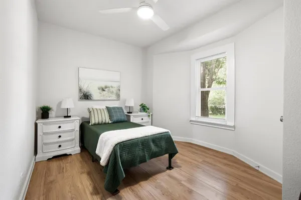 a bedroom with a bed and a window