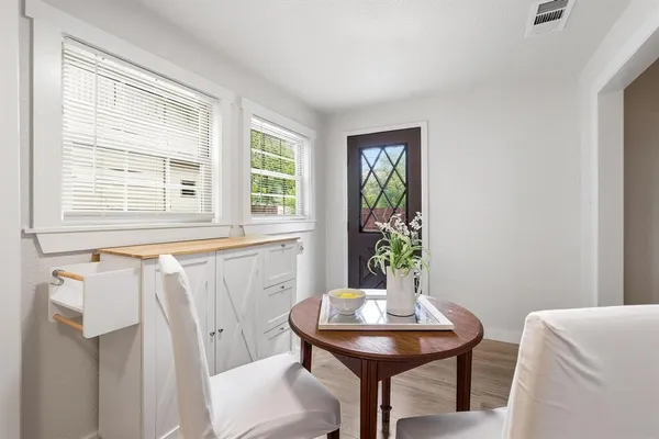 a view of a small space with wooden floor
