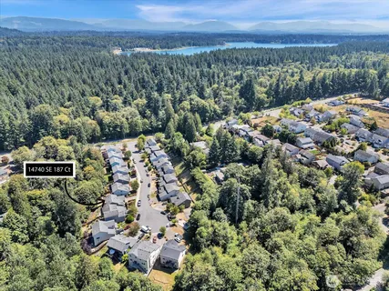 an aerial view of a house with a yard
