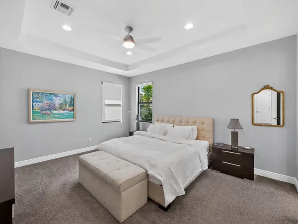 a bedroom with a bed and a night stand