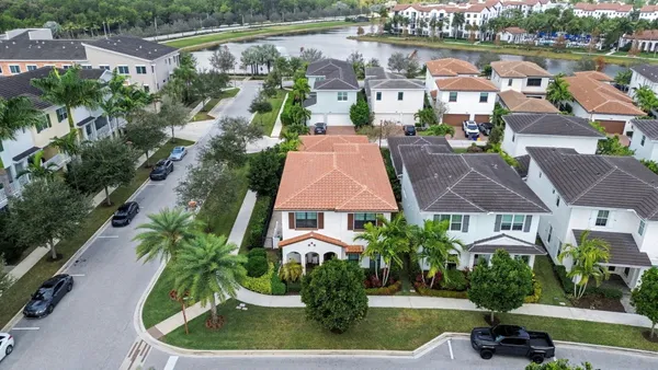 an aerial view of a house with yard swimming pool and outdoor seating