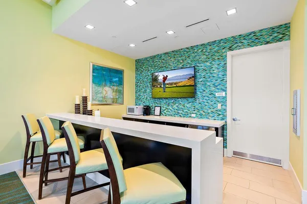 a kitchen with a table and chairs in it