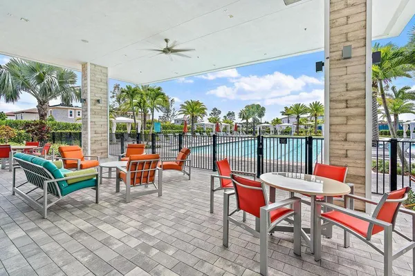 an outdoor sitting area with couch and outdoor view