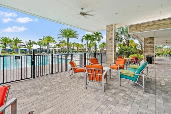 an outdoor view of a house with outdoor seating