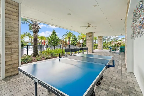 wooden floor with a table and chairs in patio