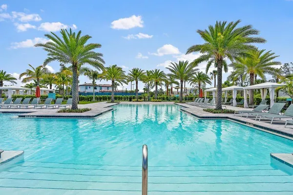 a view of a swimming pool with a table and chairs