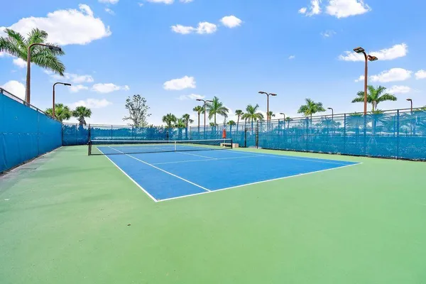a view of an outdoor space and tennis court