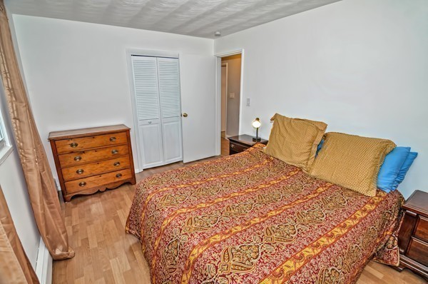 10 Edith Road Framingham, MA 01701 - Photo 15 of 30 a bedroom with a bed and wooden floor