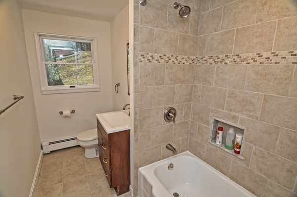 10 Edith Road Framingham, MA 01701 - Photo 17 of 30 a bathroom with a tub a sink and a shower