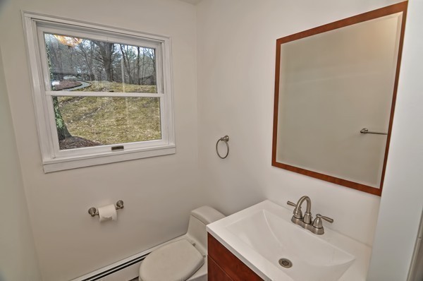 10 Edith Road Framingham, MA 01701 - Photo 19 of 30 a bathroom with a sink a window and a mirror