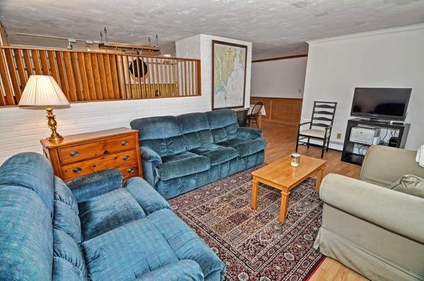 10 Edith Road Framingham, MA 01701 - Photo 2 of 30 a living room with furniture a rug and a window