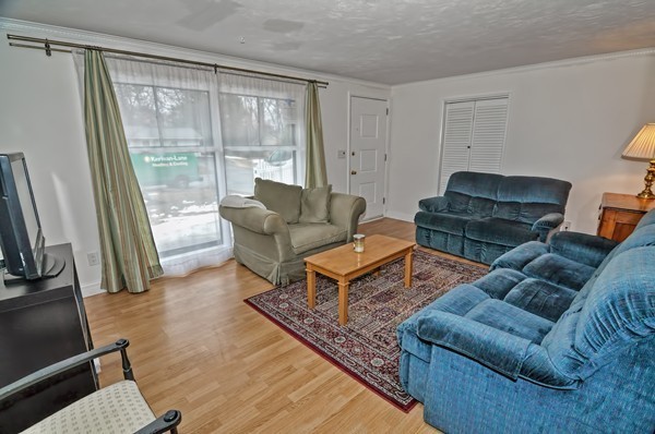 10 Edith Road Framingham, MA 01701 - Photo 3 of 30 a living room with furniture and a flat screen tv