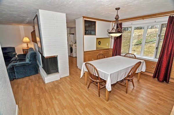 10 Edith Road Framingham, MA 01701 - Photo 10 of 30 a living room with furniture a fireplace and a flat screen tv