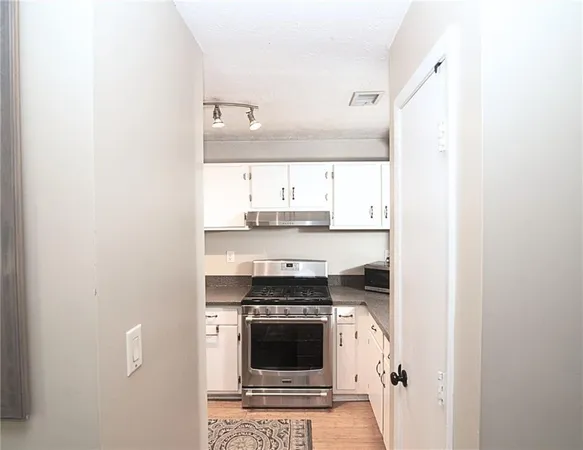 a kitchen with a stove and a microwave