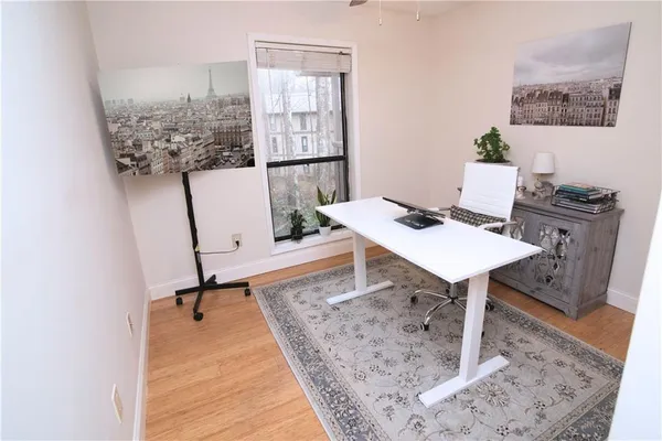 a view of a workspace with furniture