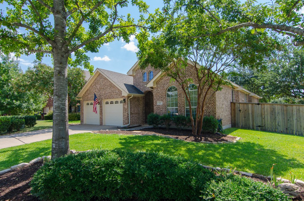 815 Fork Ridge Path Round Rock, TX 78665 - Photo 1 of 1 a front view of house with a garden