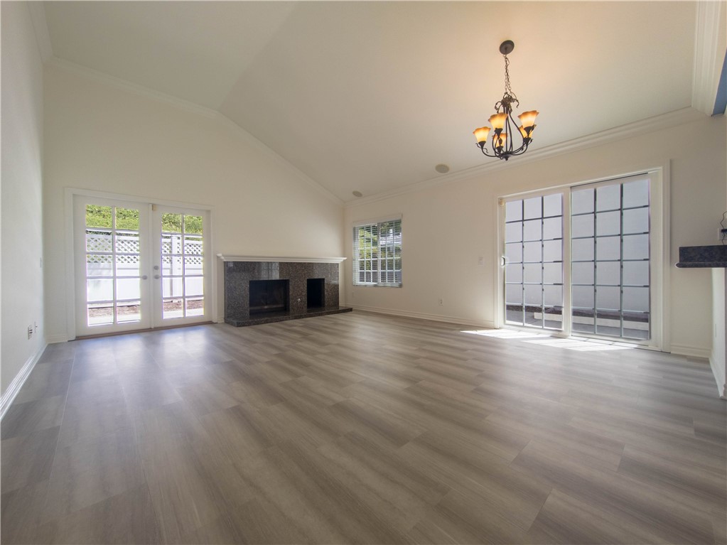 21032 Primrose Lane Mission Viejo, CA 92691 - Photo 11 of 19 an empty room with wooden floor and windows