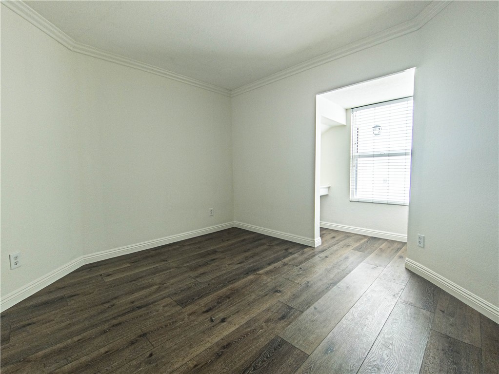 21032 Primrose Lane Mission Viejo, CA 92691 - Photo 18 of 19 an empty room with wooden floor and windows