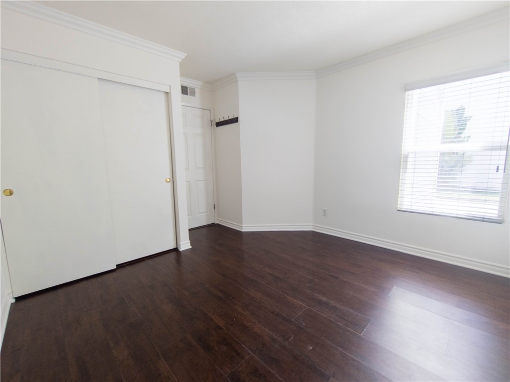 21032 Primrose Lane Mission Viejo, CA 92691 - Photo 4 of 19 an empty room with wooden floor and windows