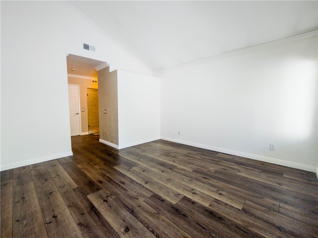 21032 Primrose Lane Mission Viejo, CA 92691 - Photo 5 of 19 a view of a livingroom with wooden floor and a ceiling fan