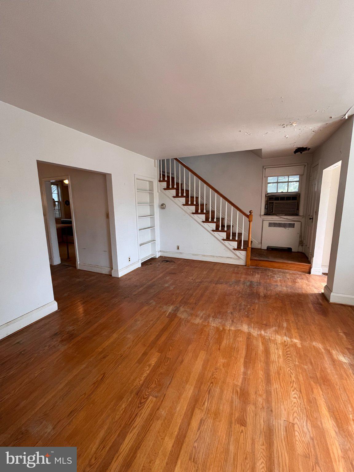 5906 Ayleshire Road Baltimore, MD 21239 - Photo 5 of 41 Spacious entryway with hardwood floors and stairs.