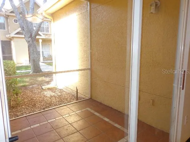 a view of a glass door with a yard