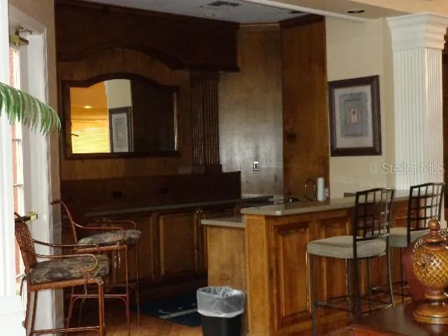 a kitchen with a sink and a stove top oven