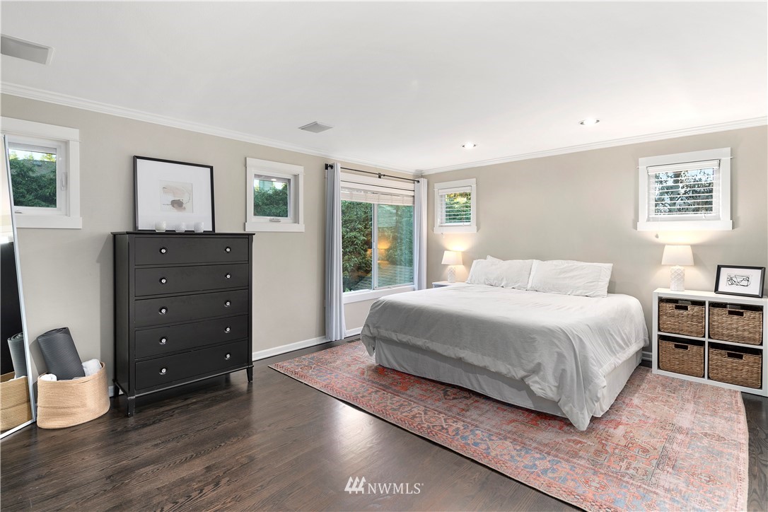 3121 210th Street Southeast Bothell, WA 98021 - Photo 22 of 40 a bedroom with a bed and wooden floor
