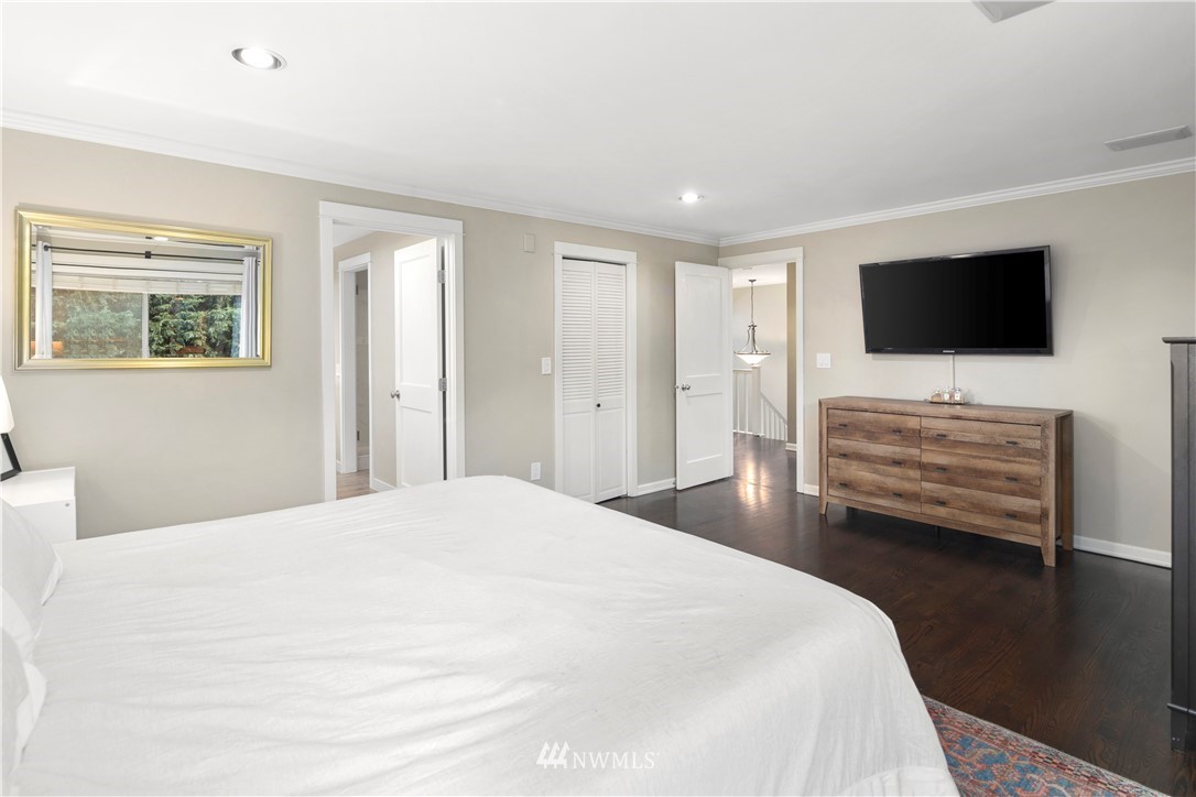 3121 210th Street Southeast Bothell, WA 98021 - Photo 23 of 40 a bedroom with a bed and a flat screen tv