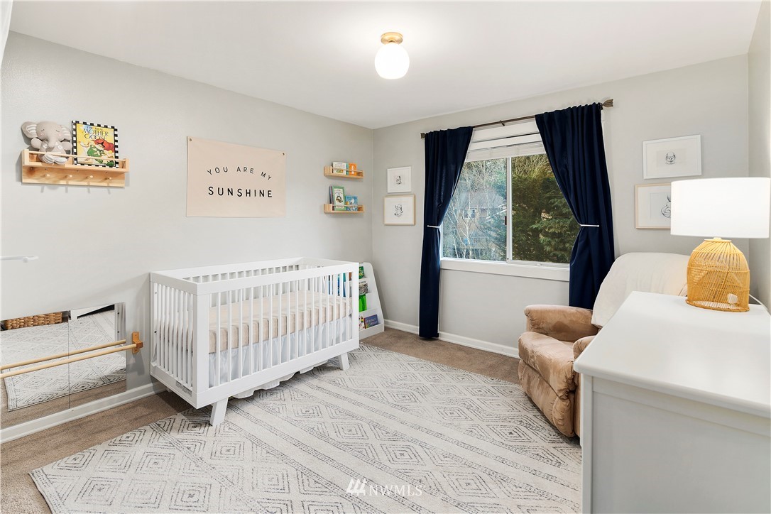 3121 210th Street Southeast Bothell, WA 98021 - Photo 27 of 40 a bedroom with furniture and a window