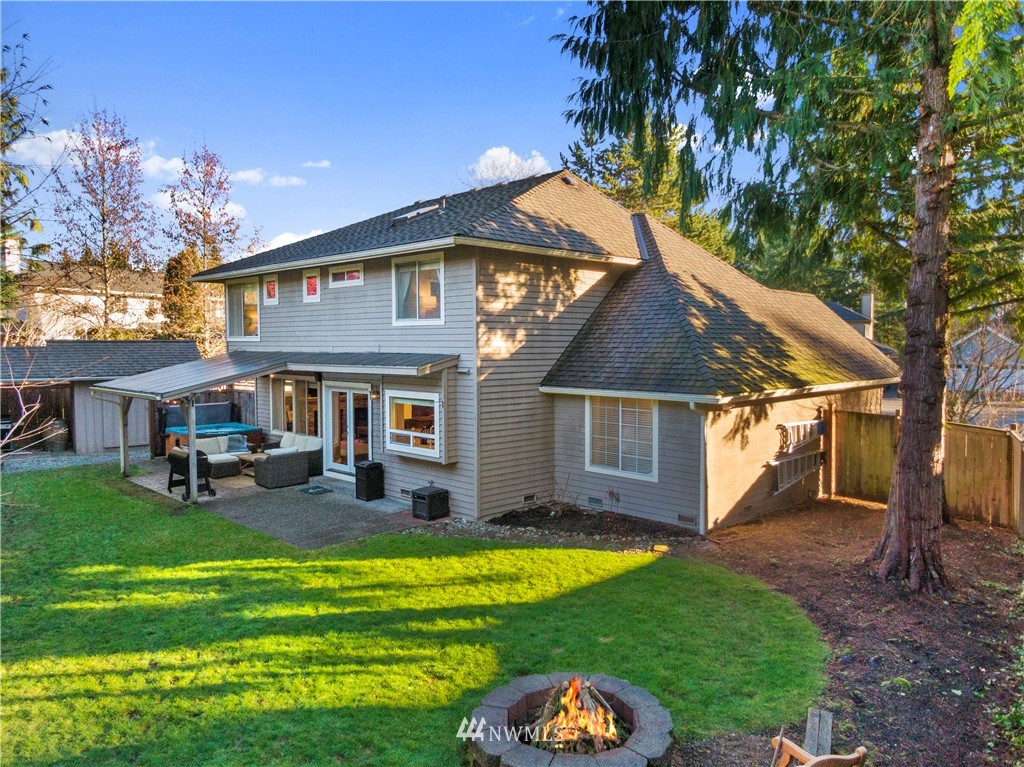3121 210th Street Southeast Bothell, WA 98021 - Photo 38 of 40 a front view of a house with a yard table and chairs