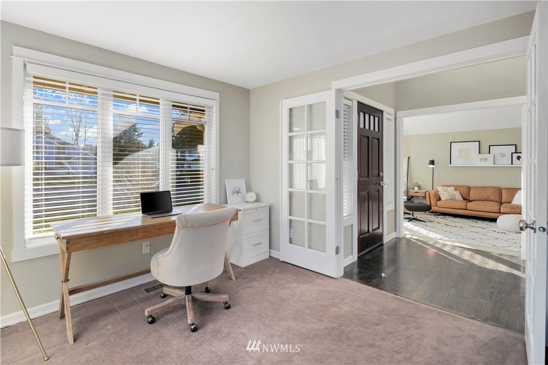 3121 210th Street Southeast Bothell, WA 98021 - Photo 5 of 40 a view of a livingroom with furniture and a window