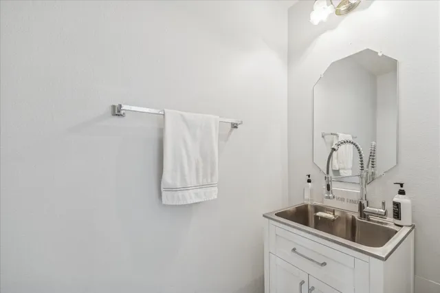 a close view of a sink and dishwasher in a bathroom