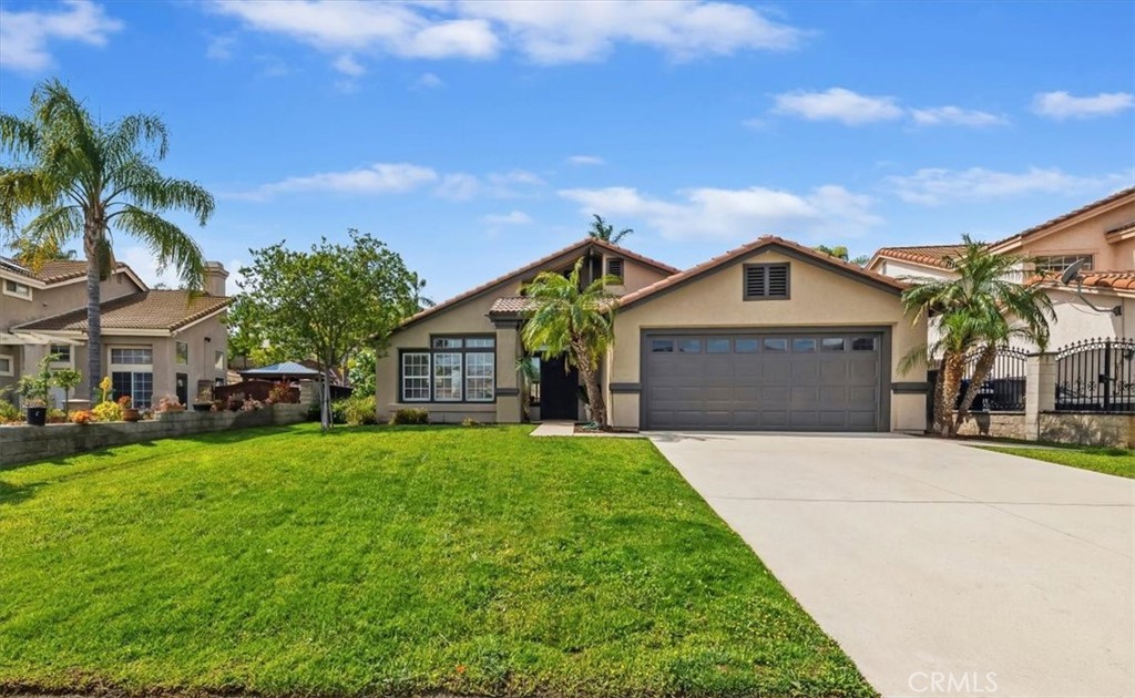20635 Bakal Drive Riverside, CA 92508 - Photo 1 of 1 a front view of a house with a yard and garage