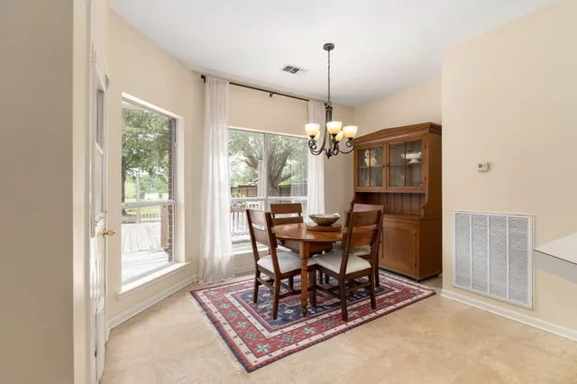 a view of a dining room with furniture window and outside view