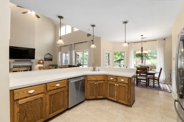 a kitchen with lots of counter top space and dining table