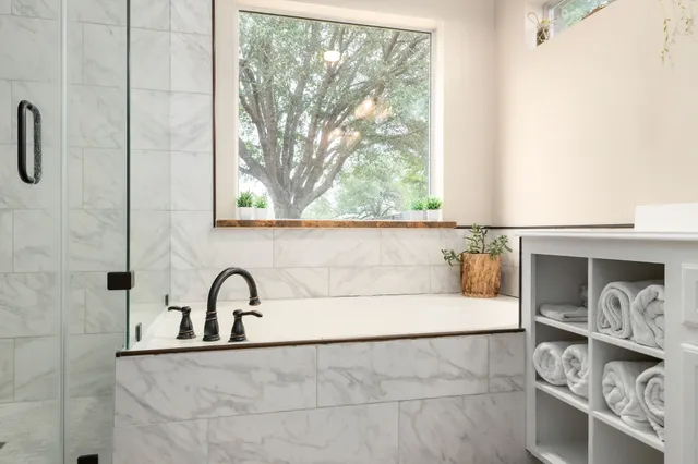 a bathroom with a sink and a window