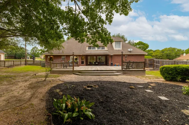 a view of a house with swimming pool and sitting area