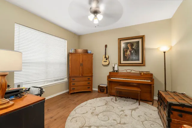 a bedroom with furniture and a window