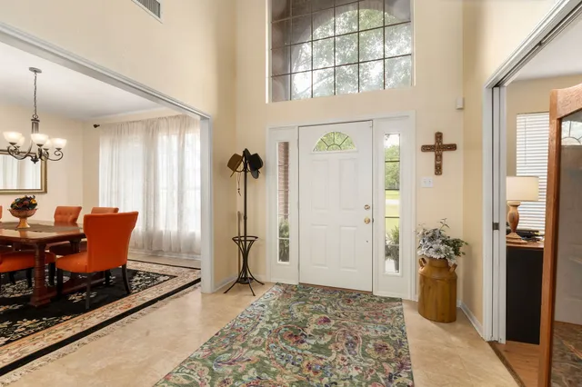 a living room with furniture and a table
